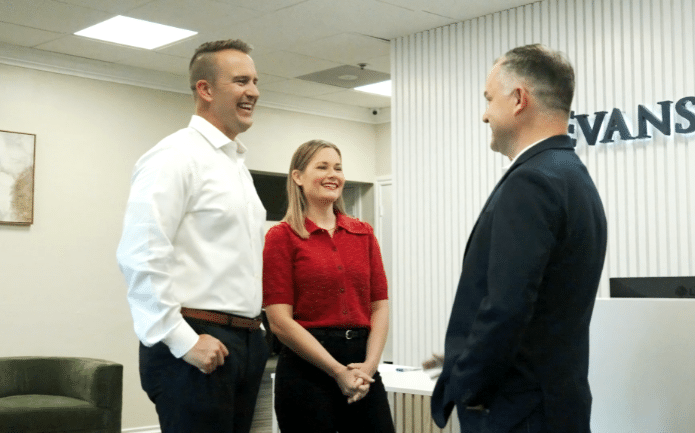 Bryan Evans speaking with clients