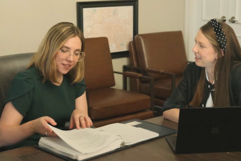 Katie A. MacKenzie reviewing documents with Jennifer L. Holland