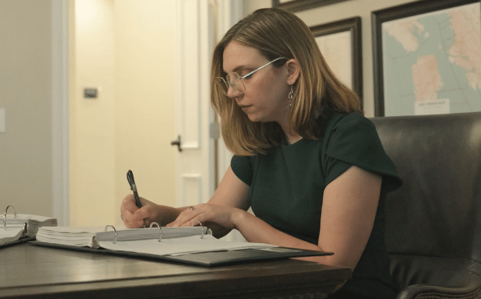 Katie A. MacKenzie reviewing estate planning drafts
