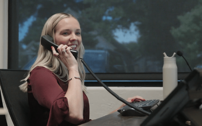 Kimri Goerke Williams smiling while speaking on phone