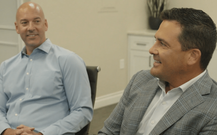 Mitch D. McCuistian and John D. Weaver in meeting