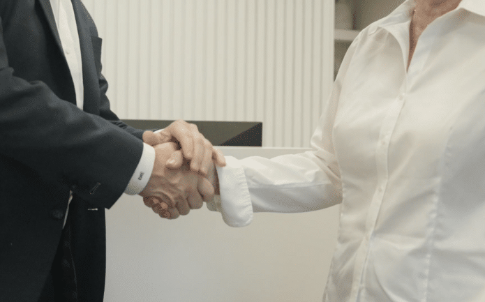 Shaking clients hand