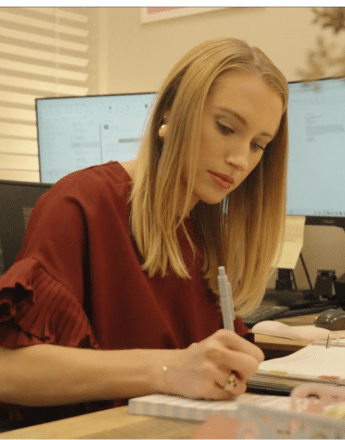 Lauren M. Thoman taking notes