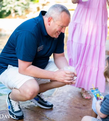 Dustin Davis entertaining kids at Summer BBQ
