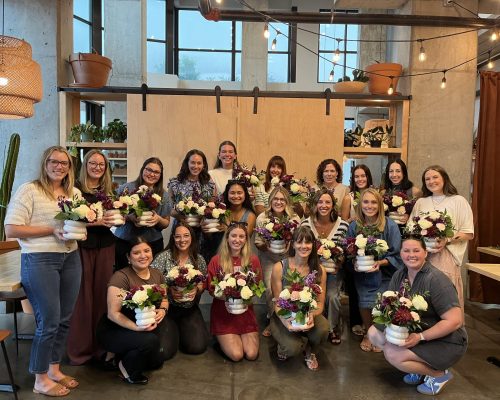 Team photo at Bouquet Making event at Evans & Davis