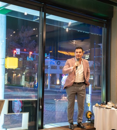 Mitch giving toast at Christmas Party