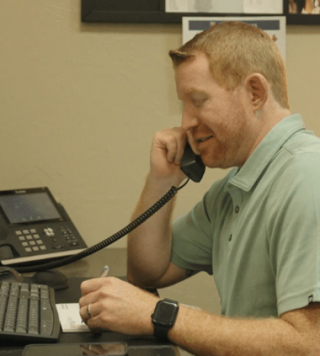 Tanner speaking to client on phone